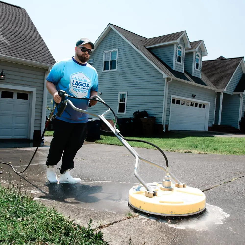 Lagos Pressure Washing crew cleaning a Raleigh driveway